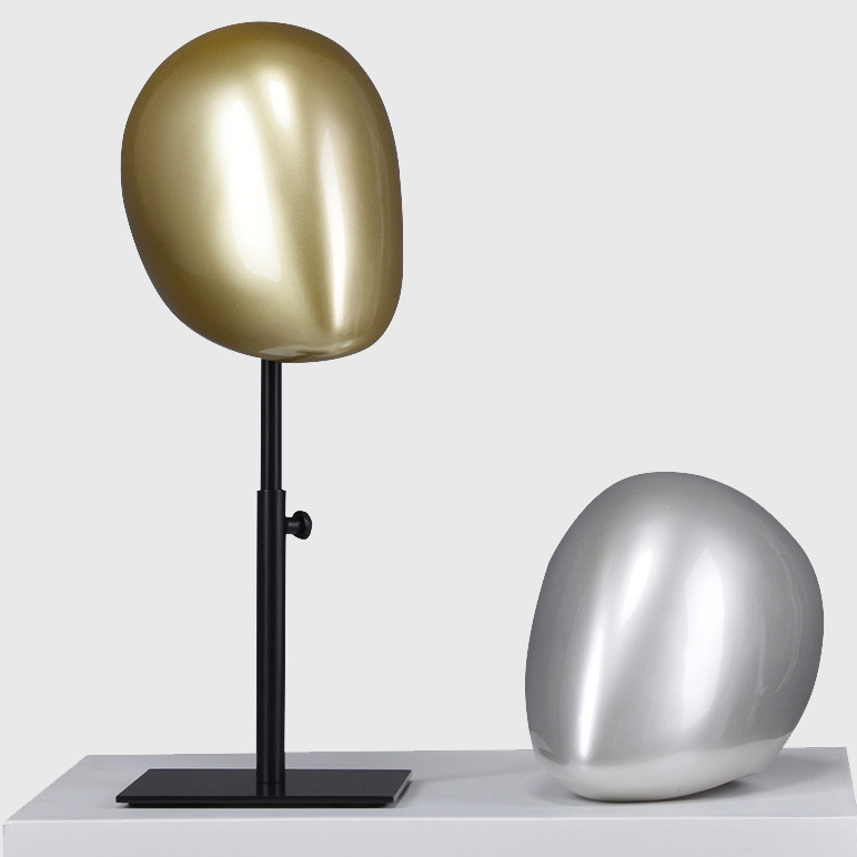 Gold and sliver color mannequin head abstract with stand